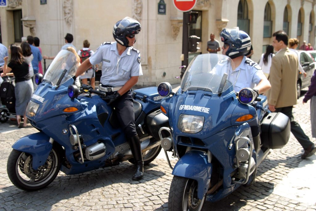 TWO French Gendarmes on motorbikes in Paris