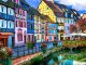 GRAND-EST lefrancophile Colmar. timber framed coloured houses on canal bank