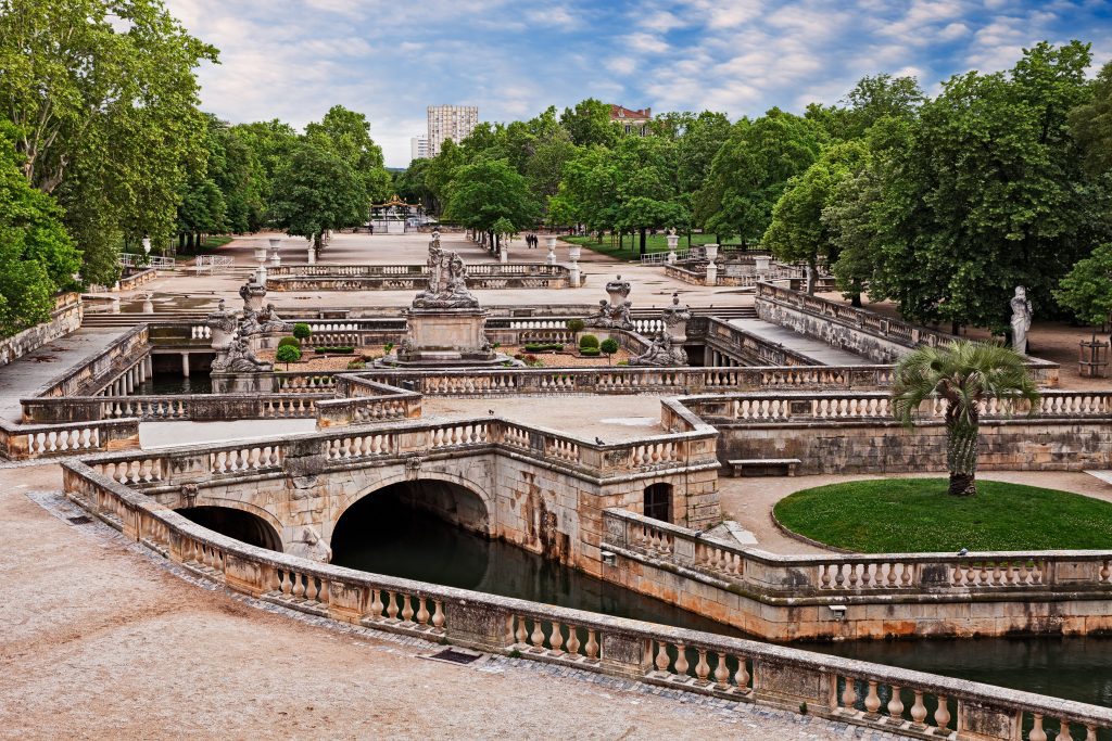 Nîmes Gardens and stone walkways over water in the Garden of Fountains