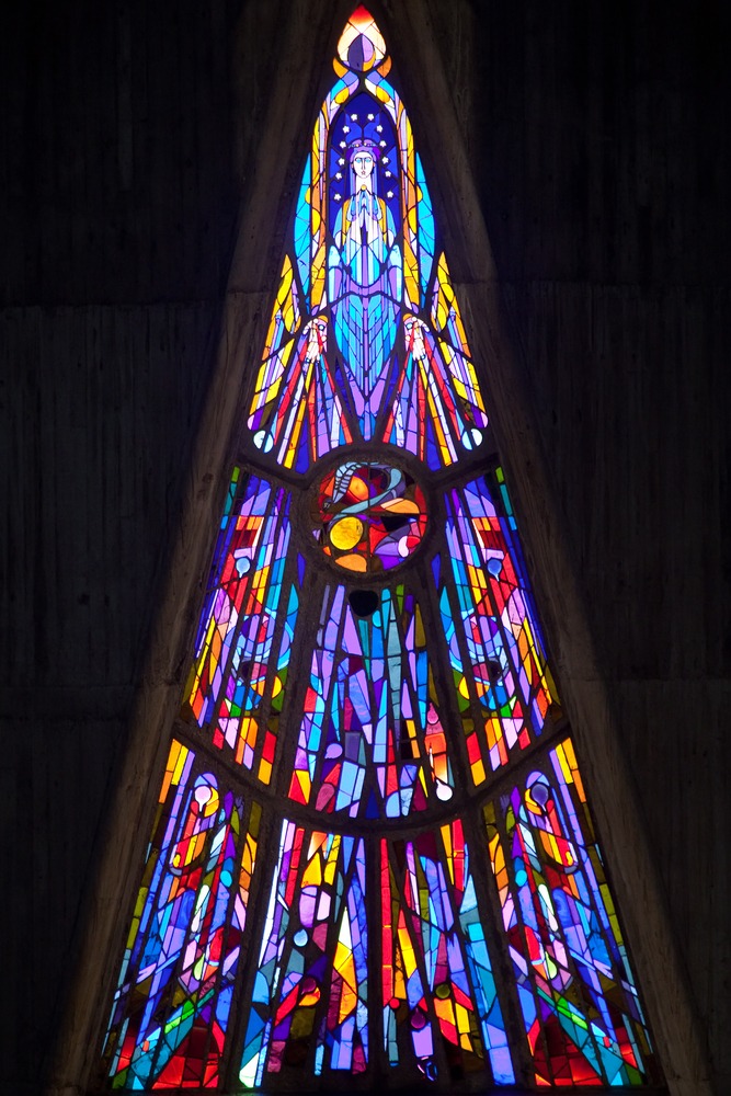 Tall triangular stained glass window