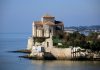 Talmont-sur-Gironde: The Flower-Filled Bastide of the Gironde The church at Talmont on the sea wall seen from a distance jutting out into Gironde Estuary